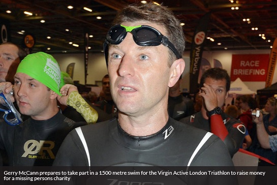 Gerry McCann prepares to take part in a 1500 metre swim for the Virgin Active London Triathlon to raise money for a missing persons charity