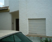 Front door and bedroom window to Apartment 5A