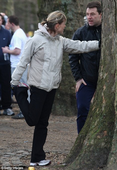 Limbering up: Kate McCann does some stretching as she chats to husband Gerry