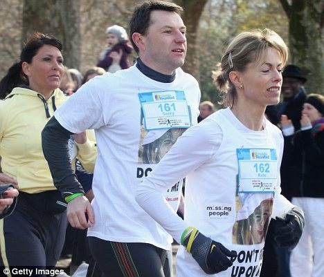United front: The McCanns wore T-shirts with Madeleine's picture on and the plea: 'Don't give up on me'