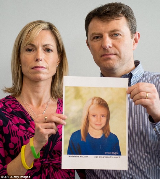 Kate and Gerry McCann pose with an artist's impression of how their daughter might look at the age of nine last year