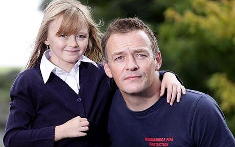 Jon Hazelhurst with his daughter Lauren who was called into a police station after she was mistaken for missing girl Madeleine McCann Photo: SWNS