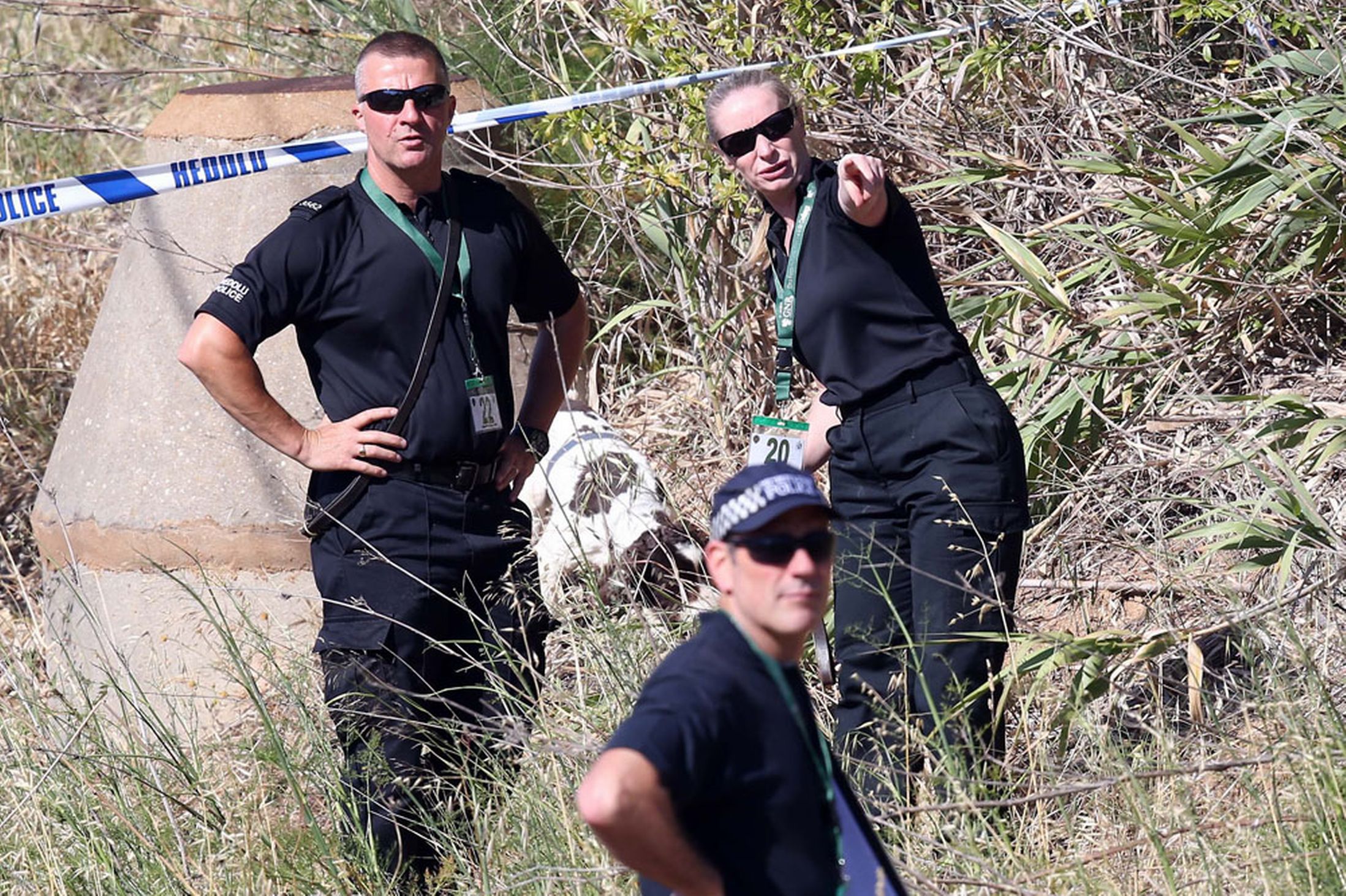 Scotland Yard detectives and Portuguese police work at an area in Praia da Luz, near Lagos, June 3, 2014.