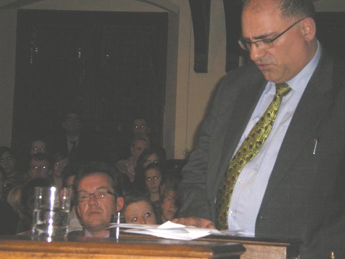 Robert Murat in the background (left of picture) as he listens to his lawyer Mr  Louis Charlambous of Simons, Muirhead and Burton