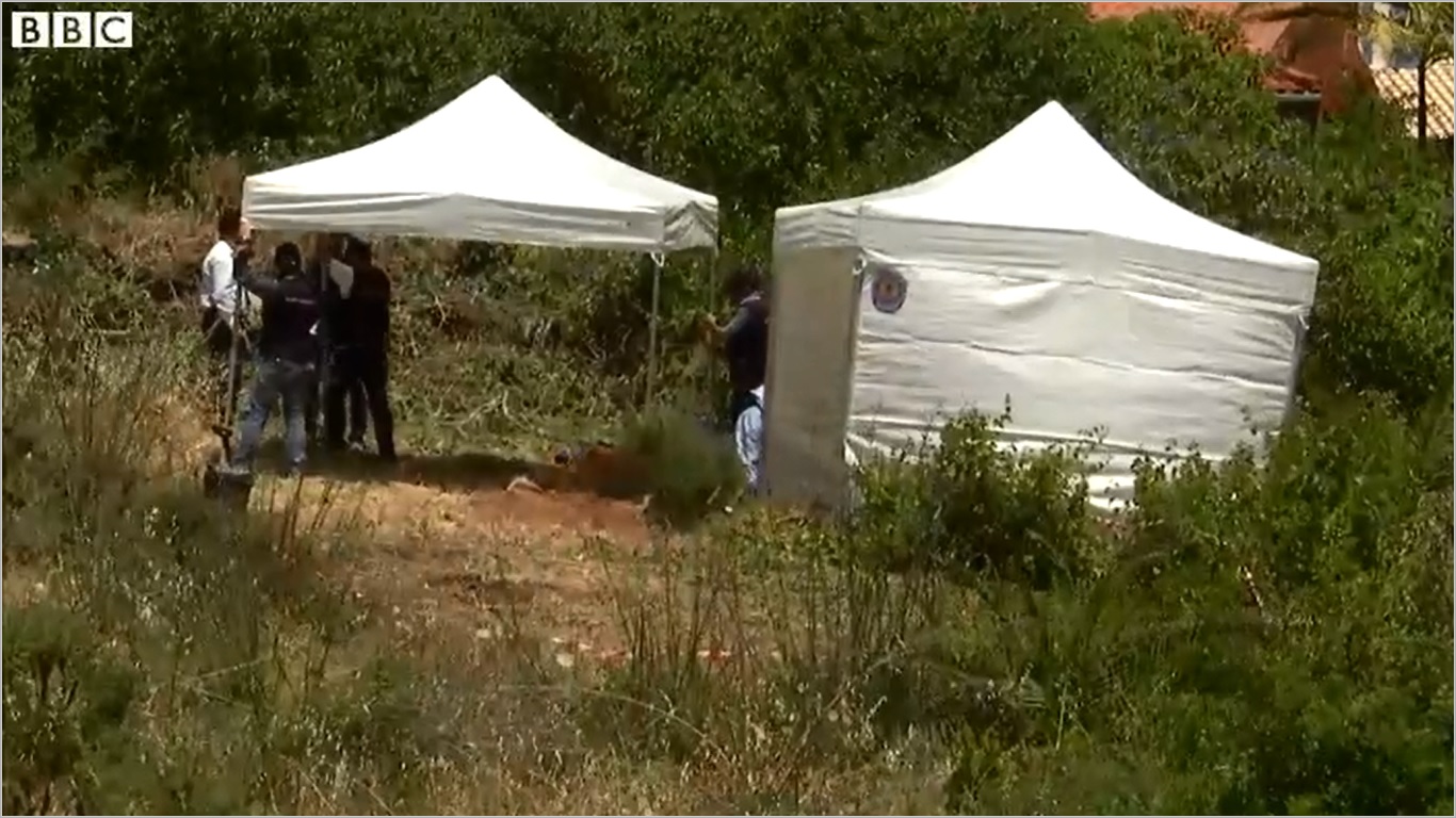 The BBC's Tom Burridge says police have erected tents over a hole