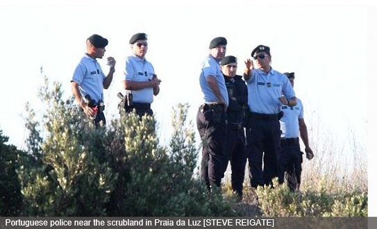 Portuguese police near the scrubland in Praia da Luz [STEVE REIGATE]