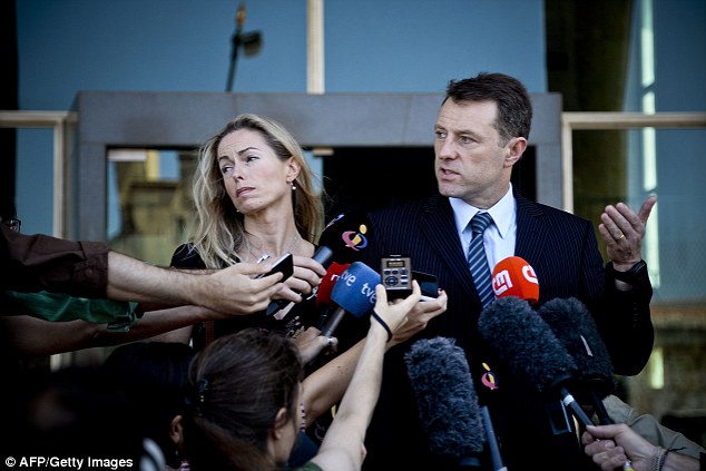 Kate McCann (left) and her husband Gerry McCann (right), parents of missing British youngster Madeleine McCann, talk to the press after delivering statements at the court house