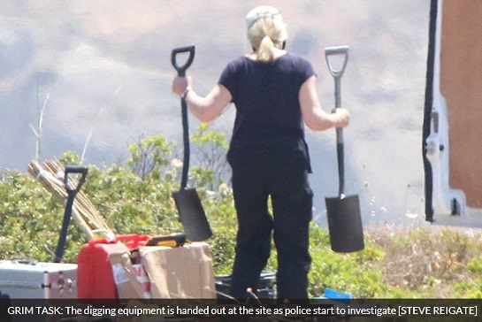 GRIM TASK: The digging equipment is handed out at the site as police start to investigate [STEVE REIGATE]