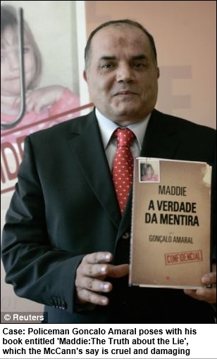 Case: Policeman Goncalo Amaral poses with his book entitled 'Maddie:The Truth about the Lie', which the McCann's say is cruel and damaging