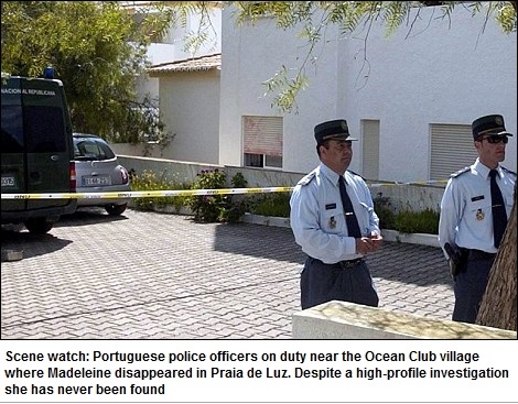 Scene watch: Portuguese police officers on duty near the Ocean Club village where Madeleine disappeared in Praia de Luz. Despite a high-profile investigation she has never been found