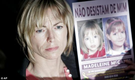 Anguish: Kate McCann, Madeleine's mother, holding a picture of her daughter in 2010 in one of her many appeals for information