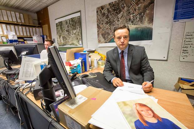 Hard work: Detective Chief Inspector Andy Redwood in the incident room