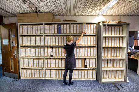 Missing person files: A staff pores over case files in the incident room