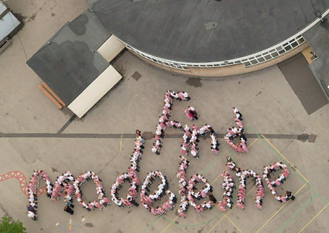 Children lined up in their playground to spell the words "Find Madeleine"