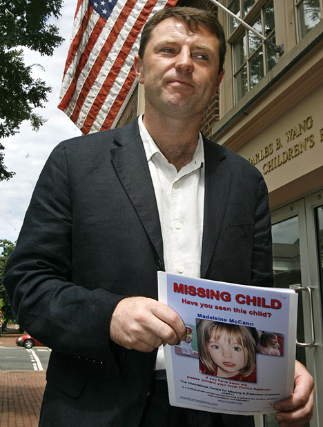 Gerry McCann with Madeleine poster