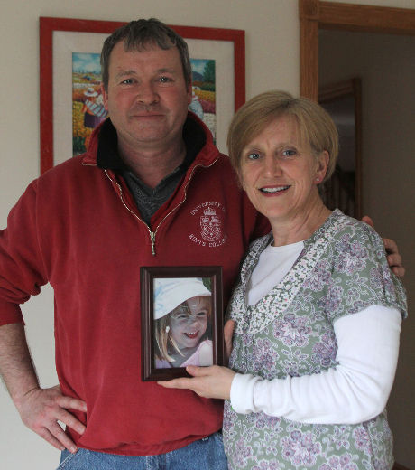Susan and Haynes Hubbard hold a picture of Madeleine McCann