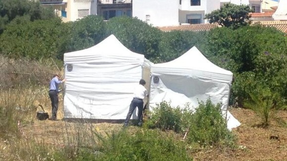 Police erect white tents over a hole they found during the search for Madeleine McCann. Credit: ITV News/Gareth Owen