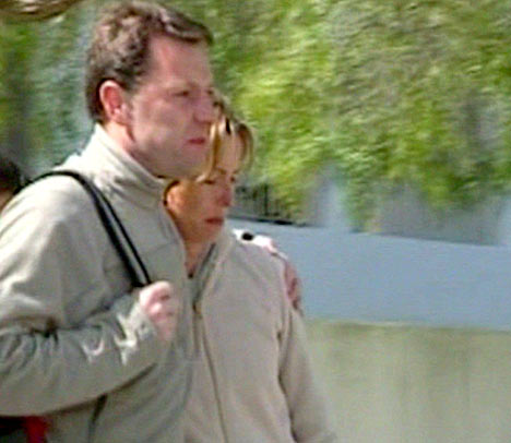 Gerry and Kate make their way to the police station on 04 May 2007