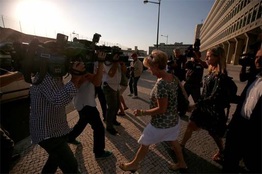 Kate McCann is surrounded by the media as she leaves court in Lisbon