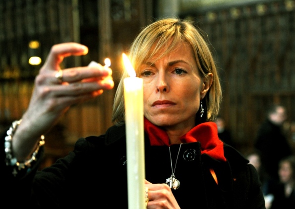 Kate McCann lights a candle inside York Minster at a vigil for Claudia Lawrence on her 37th birthday and for Madeleine McCann