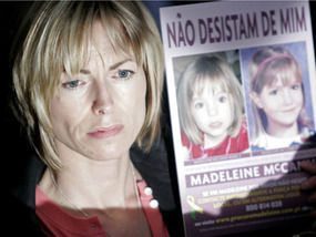Kate McCann holds up a picture of her daughter