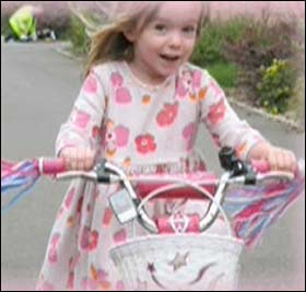 SMILES: Maddie on her bike 