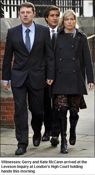 Witnesses: Gerry and Kate McCann arrived at the Leveson Inquiry at London's High Court holding hands this morning