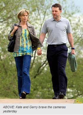 Kate and Gerry McCann brave the cameras yesterday