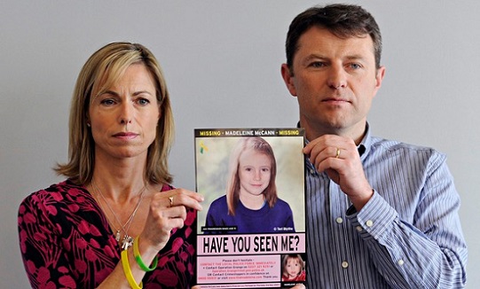 Kate and Gerry McCann display a picture of how daughter Madeleine may look at the age of seven. Photograph: Facundo Arrizabalaga/EPA