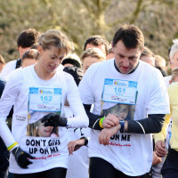 The parents of Madeleine McCann have joined 450 runners to take part in a fun run for missing people