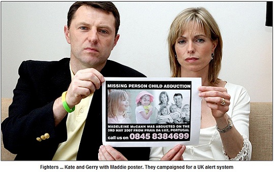 Fighters ... Kate and Gerry with Maddie poster. They campaigned for a UK alert system