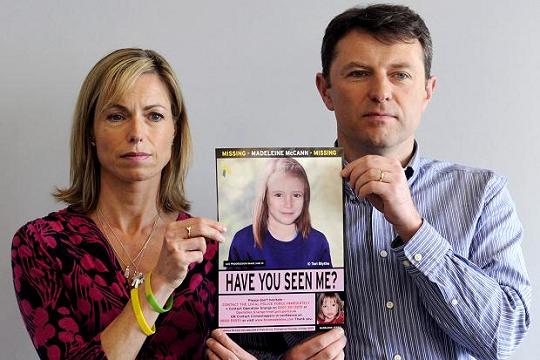 Kate and Gerry McCann with an age-processed image of Madeleine on the fifth anniversary of her disappearance in 2012 Facundo Arrizabalaga/EPA
