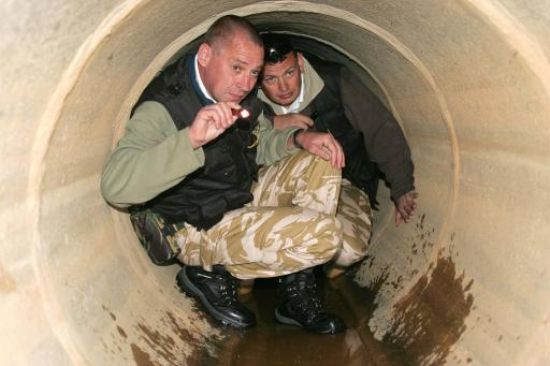 Colin Sahlke (left) and Stephen Taylor search a drainage tunnel in Praia da Luz