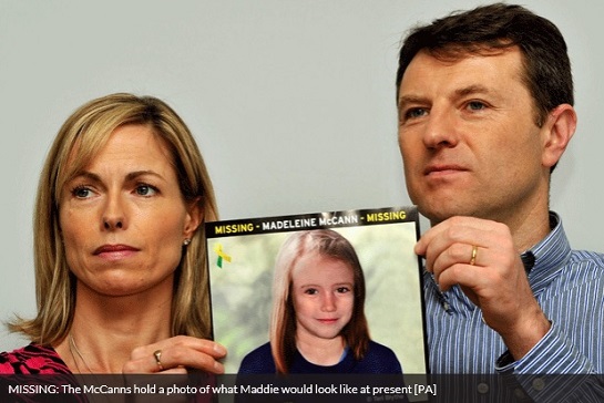 MISSING: The McCanns hold a photo of what Maddie would look like at present [PA]