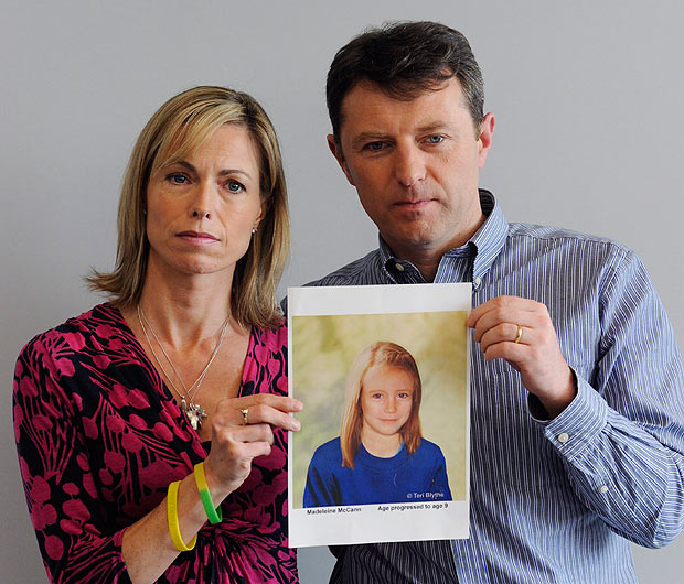 Search continues ... Gerry and Kate McCann hold artist's impression of how Maddie might look at age nine