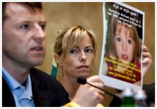 Kate and Gerry McCann, parents of the girl, with a poster for their search.