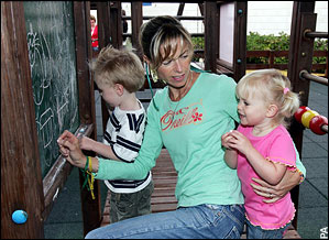 Kate McCann playing with twins Sean and Amelie
