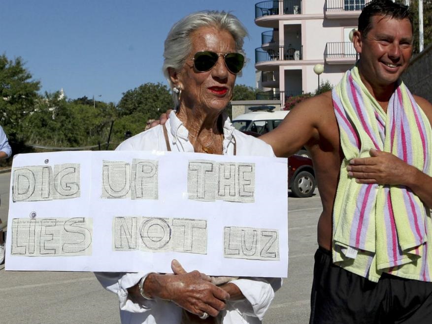 Local resident 'Nana' holds a sign: 'Dig up the lies not Luz'
