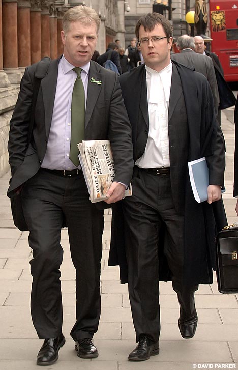 McCanns spokesman Clarence Mitchell with solicitor-advocate Adam Tudor outside the High Court